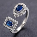 Silver open ring with blue pear and rectangular zircon stones on dark texture - Adjustable Open / Silver + Blue Zirconia