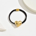 Elegante elastische haarelastiek met gepolijste gouden hartbedel en zwarte elastiek - Hart Goud C5520
