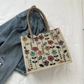 Linen tote bag with vintage floral print and brown braided handles on denim jacket - Style 2