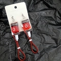 Macro detail of Y2K style blood bag earrings with red liquid effect and type O label - Type O Stud Earrings