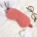 Soft pink teddy fleece sleep mask with elastic satin strap on plush background - Watermelon red