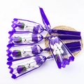 Macro detail of five purple soap rose bouquets with white bears in purple lace wrapping - Purple (Colorful)