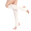Close-up of cream knitted leg warmers with vertical ribbed pattern for ballet and yoga - One Size / White