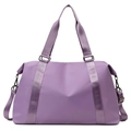Macro shot of purple waterproof nylon gym bag featuring adjustable strap and metal hardware - Light Purple
