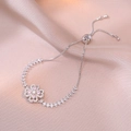 Detail of adjustable silver clover bracelet with pink zircons on silk background - Steel Color Pink Rotating Bracelet (TS0186)