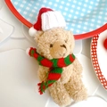 Beige plush teddy bear with festive red Christmas hat and green scarf decoration - Joint Bear with Knitted Hat and Red-Green Scarf