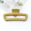 Matte yellow rectangular leopard pattern hair claw clip on a white floral magazine - Avocado Green