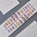 Detail of 3D porcelain nails with fish and lemon patterns on a white display board - Lemon Fish Floral Polka Dot Style (WY-016) / Multi-piece Box Set