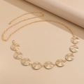 Detailed view of golden textured round metal discs on a beach style body waist chain - Ripple Circle Style (1698) / Gold
