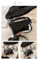 Minimalist black crossbody waist bag with asymmetrical flap and sleek matte finish - Black