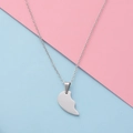 Polished silver half-heart pendant necklace displayed on a pastel blue and pink surface - Small Steel Single Piece