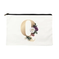 Canvas makeup bag featuring a large golden letter Q and floral pattern accents - Letter Q