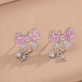Detail of silver bow earrings featuring pink heart stones and zircon fringe tassels - Silver Pink Bowknot Stud Earrings (8844)