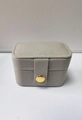 Light gray cross-grain leather travel jewelry box with golden snap button closure - Gray