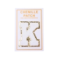 Detail of chenille letter K patch with gold glitter edge and peel and stick adhesive back - Letter K / White