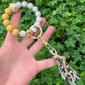 Close-up of yellow and marble silicone bead keychain with leopard print tassel - Leopard Tassel Yellow Marble Beaded (款21)
