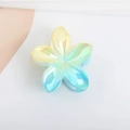 Macro view of gradient laser-effect frangipani hair claw with high-gloss finish - Plated Blue Yellow