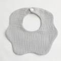 Detail of grey muslin cotton baby bib with petal shape edges and white snap closure - Light Gray