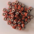 Detailed top view of sparkling orange crystal pavé large hole beads for jewelry making - Orange Red