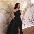 Detail view of the high slit and asymmetric one-shoulder design on a black evening gown - S / Dress (1604) / Black