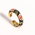 Macro detail of adjustable gold ring with black enamel floral pattern and colorful petals - Adjustable Open / Black