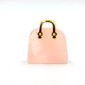 Miniature pink quartz handbag pendant with a sleek gold metal handle on white backdrop - Rose Quartz