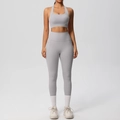 Detail of high-waist light grey yoga leggings with side pockets and matching sports bra set - Frost Grey
