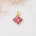 Macro shot of square pendant with four pink trapezoid zircons and gold-plated copper link - Light Pink