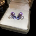 Detail shot of sparkling purple crystal and white pearl bow earrings on velvet tray - 81# Silver Earring Post - Purple - Geometric