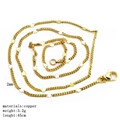 Detail view of a 45cm gold-plated copper chain necklace with delicate star charms - Star Curb Chain
