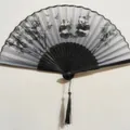 Japanese style folding fan featuring ink panda pattern with black silk tassel - Black Ribs Style 65