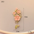 Detail view of 52mm floral alloy pendant with pink enamel petals and golden leaf finish - Pink Green Enamel Flower (3921)