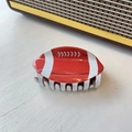Rugby ball hair claw clip in red and white on a white wooden background - Large Red Football (9cm)