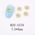 Détail de bijoux d'ongles flocon dorés avec strass bleu clair, dimensions 7,5x8mm - Style Flocon de Neige (A578)