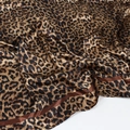 Detailed view of leopard print silk satin scarf featuring glossy texture and brown borders - Dark Coffee Leopard