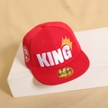 Detailed side view of red flat brim baseball cap with 3D King embroidery on wood stand - 48-54cm (2-8 Years) / Red