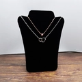L-shaped black velvet bust stand displaying silver and rose gold interlocking necklaces - Portrait Shape / Black Portrait Board