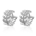Macro shot of silver leaf-shaped hoop earrings with sparkling cubic zirconia inlay - Silver