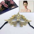 Golden butterfly lace masquerade mask with intricate embroidery and black silk ties - Cross