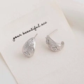 Silver teardrop stud earrings with zircon star pattern on white jewelry card - Silver C-Shaped Studs