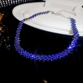 Detail of luxury geometric rhombus choker with blue and silver diamonds on display - Blue