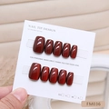 Handmade cherry red cat-eye press-on nails in medium square shape on a display card - Cherry Red Cat Eye (FM036-XS)