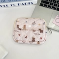 Detail view of a pink quilted cotton pouch with Happy Bear print and metal key ring - Happy Bear