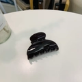 Macro detail of glossy dark acetate hair claw clip on a minimalist white table surface - Approx 6.8cm / Chocolate