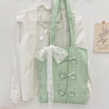 Detalle del bolso tote de lentejuelas verde menta con lazo de encaje y detalles plateados - Verde con Lazo de Encaje