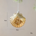Golden scallop shell Christmas ornament with pearls and sequins on pine branch decoration - Shell