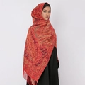 Red paisley core-spun yarn shawl scarf with tassels worn over head and shoulders - Bright Red Tassel (T490-01)
