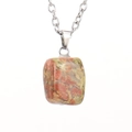 Macro detail of natural unakite stone pendant with red and green mineral textures - Silver Style B