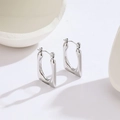 Macro detail of geometric silver titanium steel rectangle earrings with high-polish finish - Steel Color Geometric Trapezoid