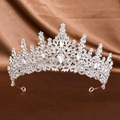 Elegant silver bridal crown with sparkling rhinestones on brown silk background - Silver